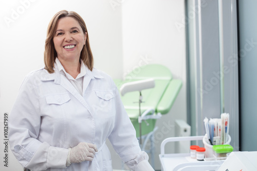 Cheerful female doctor is working with joy © Yakobchuk Olena