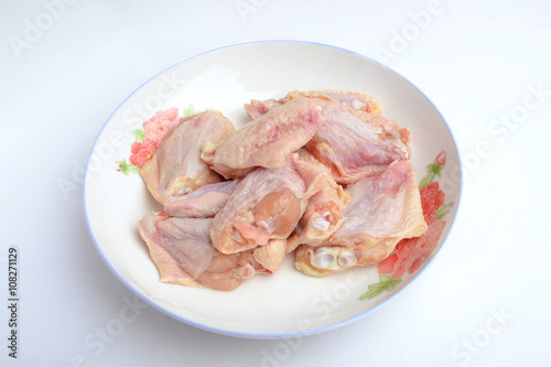 Raw chicken wings on a plate 