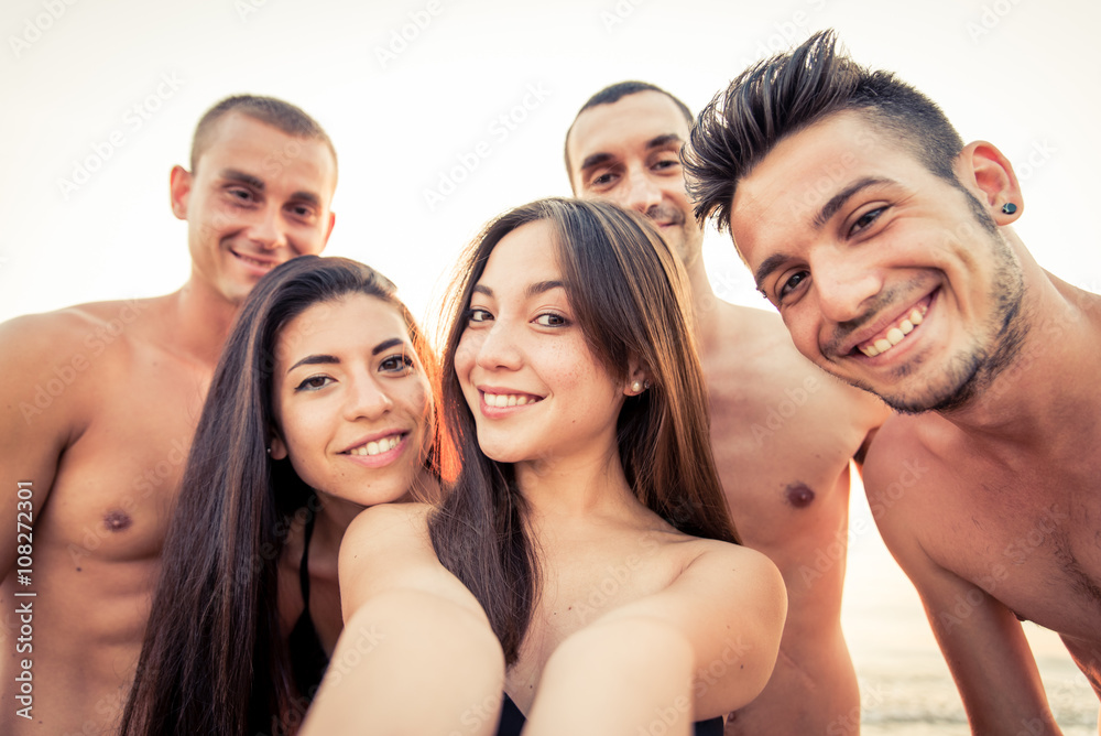 Group of friends taking selfie on the beach Group of friends taking selfie on the beach