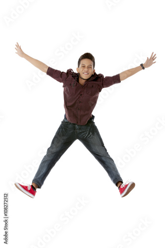 a handsome young man jumping
