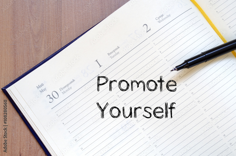 Promote yourself write on notebook Promote yourself write on notebook