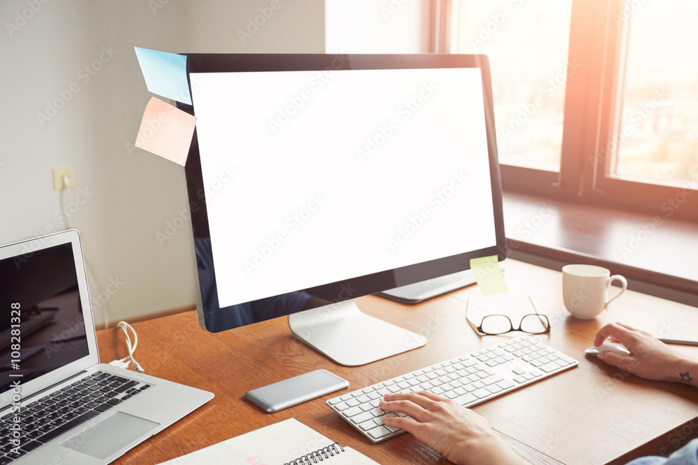 Cropped image of woman's hands keyboarding on her computer while sitting in the office, young female office worker using net-book with blank copy space screen for your text message or content