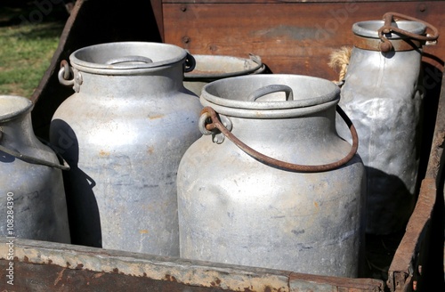 ancient milk cans aluminum  to deliver milk in the dairy photo