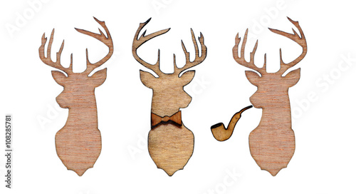 Group of wooden emblems of deer on white background isolated