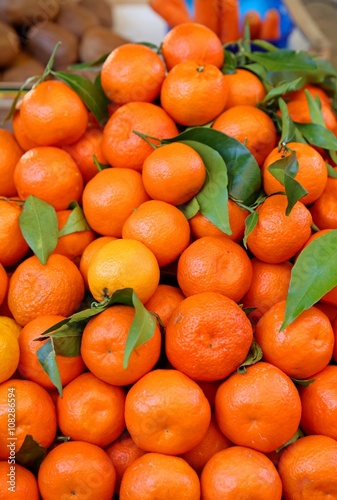 ripe orange tangerines for sale in greengrocers