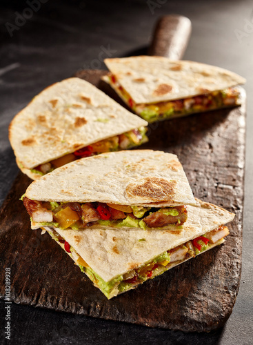 Four meat and veggie filled quesadillas