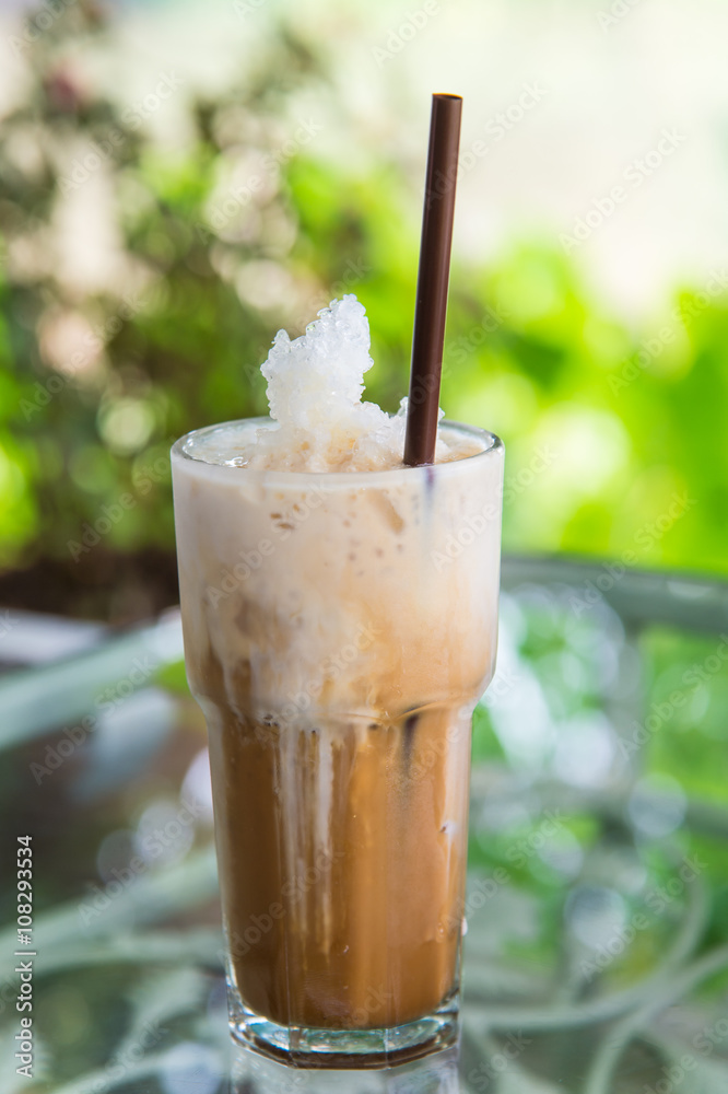 Glass Of Cold Coffee on the table Glass Of Cold Coffee on the table