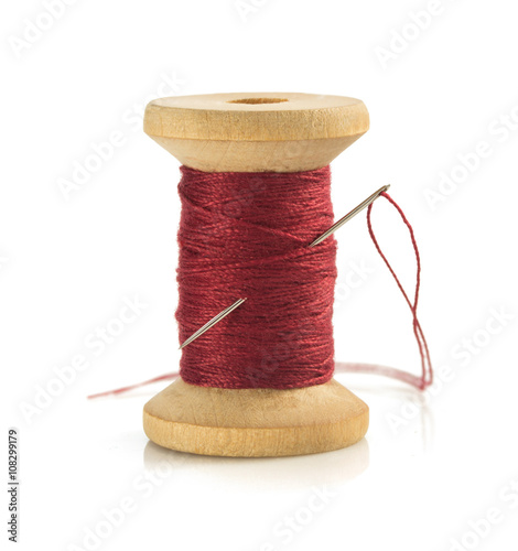 Canvas Print spool of thread and needle on white
