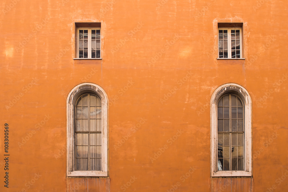 Orange facade of a house in Rome, Italy