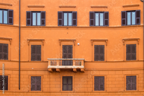 Orange facade of a house in Rome, Italy