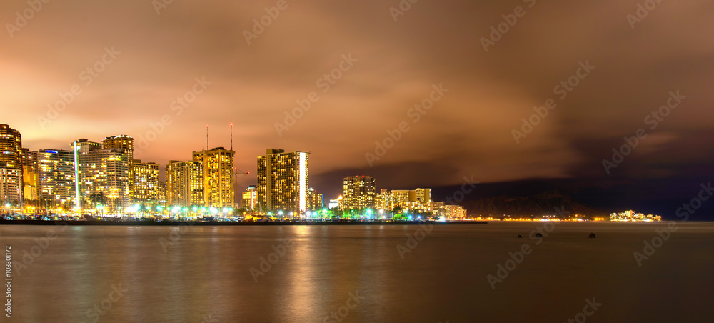 Long exposure of Waikiki skyline in Honolulu, Hawaii at night