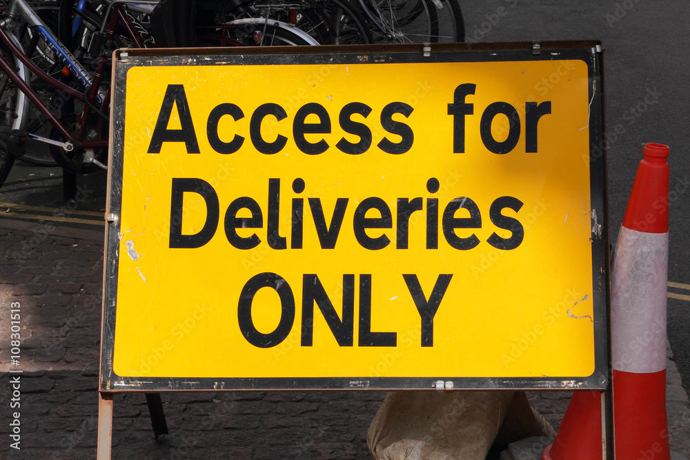 CAMBRIDGE, UK - APRIL 17, 2016: Continuing development in the city is causing road closures and diversions as illustrated by this 'Access for Deliveries ONLY' sign - Illustrative Editorial CAMBRIDGE, UK - APRIL 17, 2016: Continuing development in the city is causing road closures and diversions as illustrated by this 'Access for Deliveries ONLY' sign - Illustrative Editorial