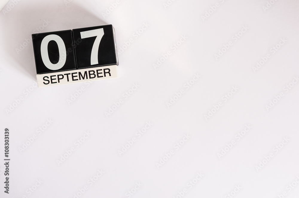 September 7th. Image of september 7 wooden table calendar on white background. Autumn day. Empty space for text
