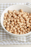 Dried chickpeas in a white bowl