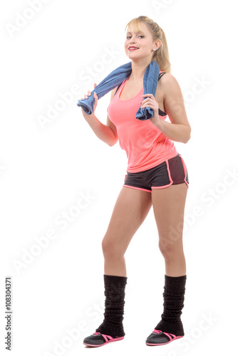 cheerful smiling young woman with towel after gym
