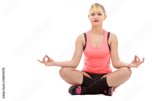 Portrait of a beautiful young woman sitting in yoga