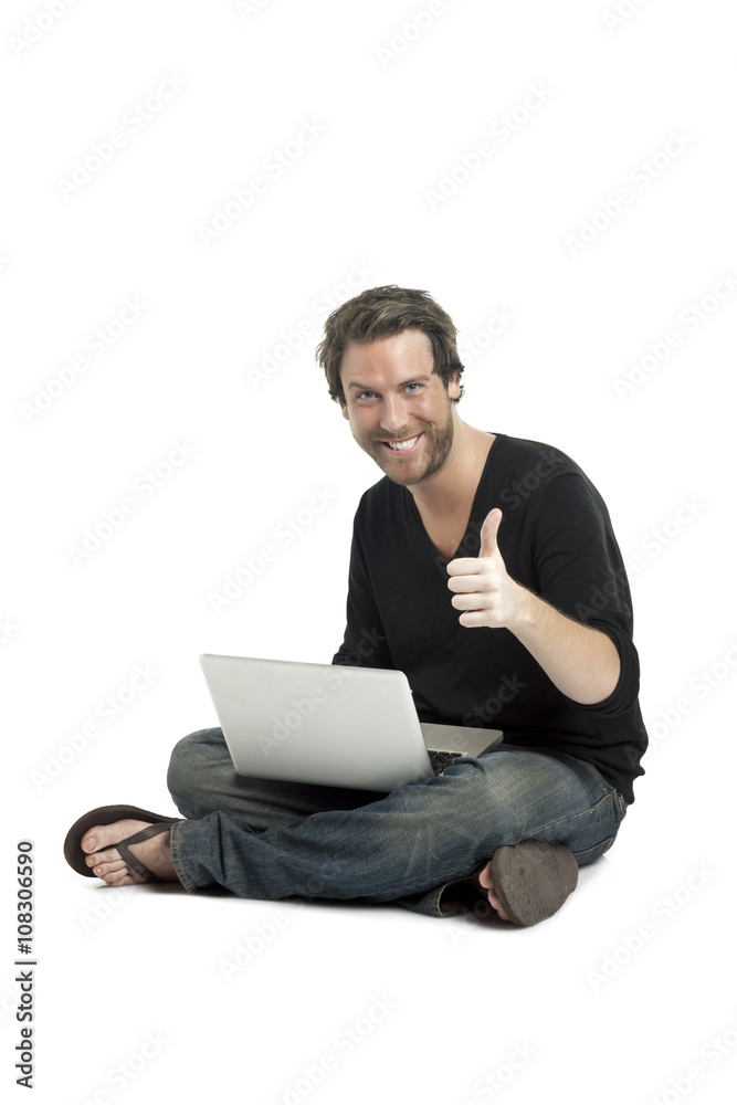 man with laptop gesturing approved