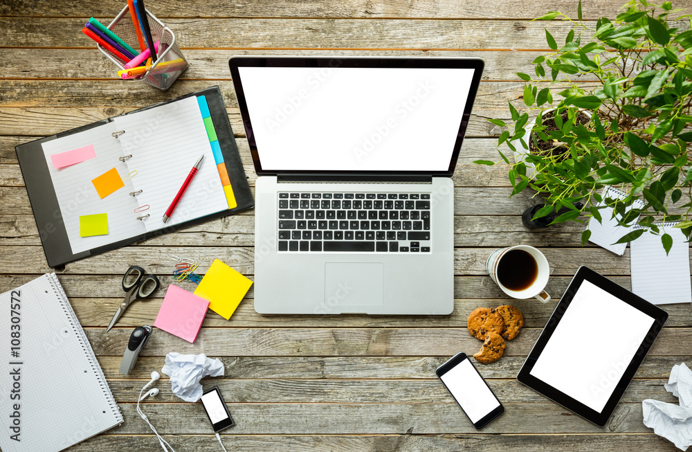 Laptop with other modern electonic devices on desk Laptop with other modern electonic devices on desk