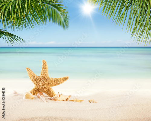 Summer sandy beach with blur ocean on background