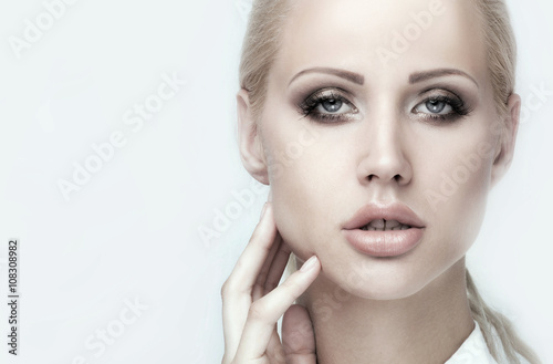 Beauty portrait of blonde young woman.