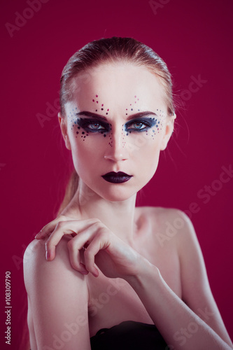 Beauty Fashion Model Girl with Black Make up. Pink background