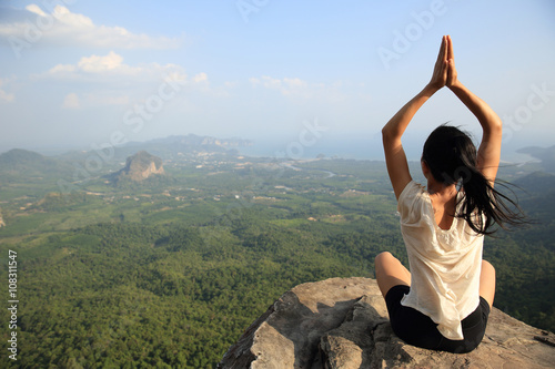 yoga woman mountain peak