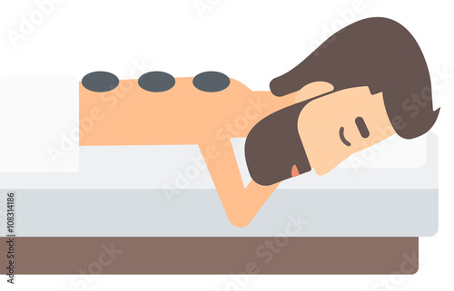 Man getting stone therapy.