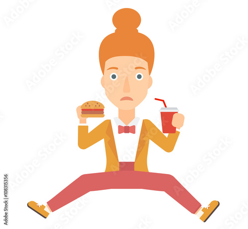 Woman eating hamburger. 