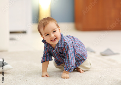 Cute baby on the floor in t...