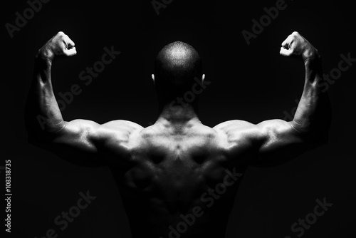 Physically Man Showing His Well Trained Back © Jale Ibrak
