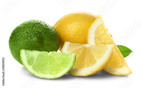 Ripe lime and lemon with slices isolated on white