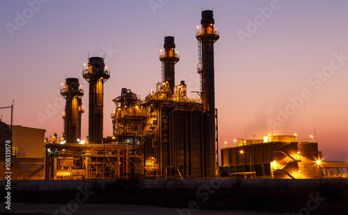 Gas turbine electrical power plant at dusk with light