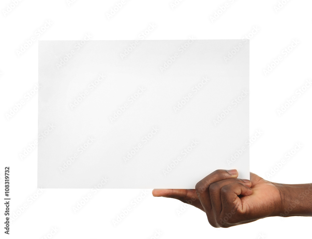 Male hands holding sheet of paper isolated on white Male hands holding sheet of paper isolated on white