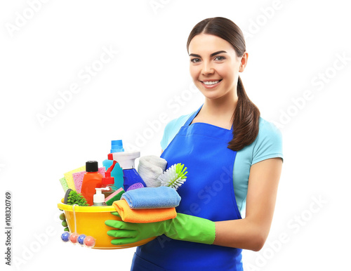 Young woman holding cleaning tools and products in tub, isolated on white