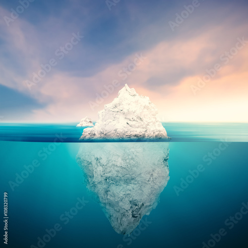 iceberg with cloudy sky