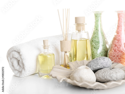 Spa treatment with essential oils isolated on white.