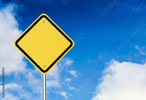 blank warning sign on blue sky background