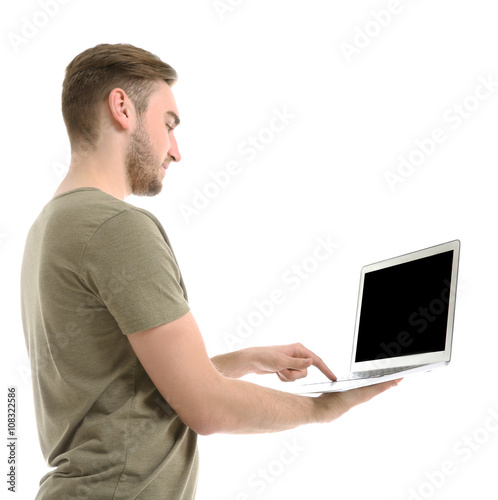 Young man using laptop, iso...