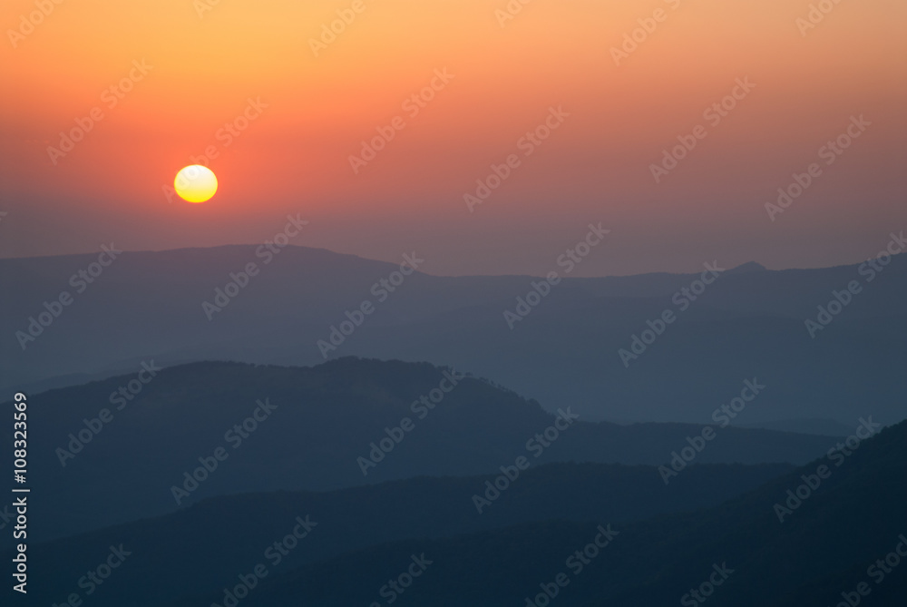 Sunrise in the mountains and mountains silhouette