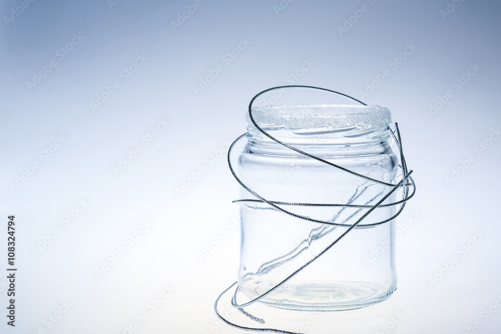 decorated clean glass jar againt light background