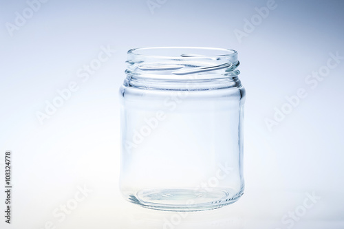 decorated clean glass jar againt light background