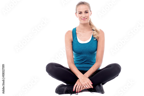 Female trainer sitting with legs crossed