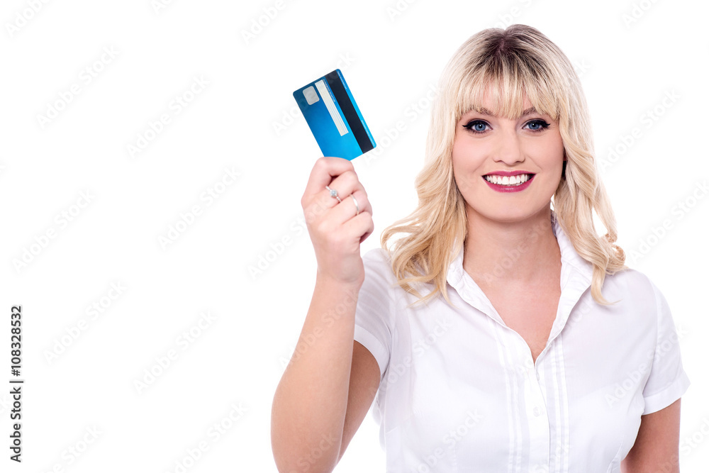 Delightful lady holding credit card Delightful lady holding credit card