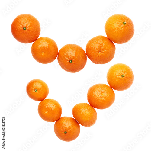 Yes tick mark made of multiple juicy tangerines isolated over the white background, top view