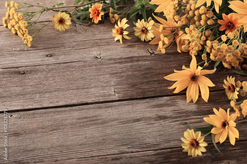flowers on wooden background photo