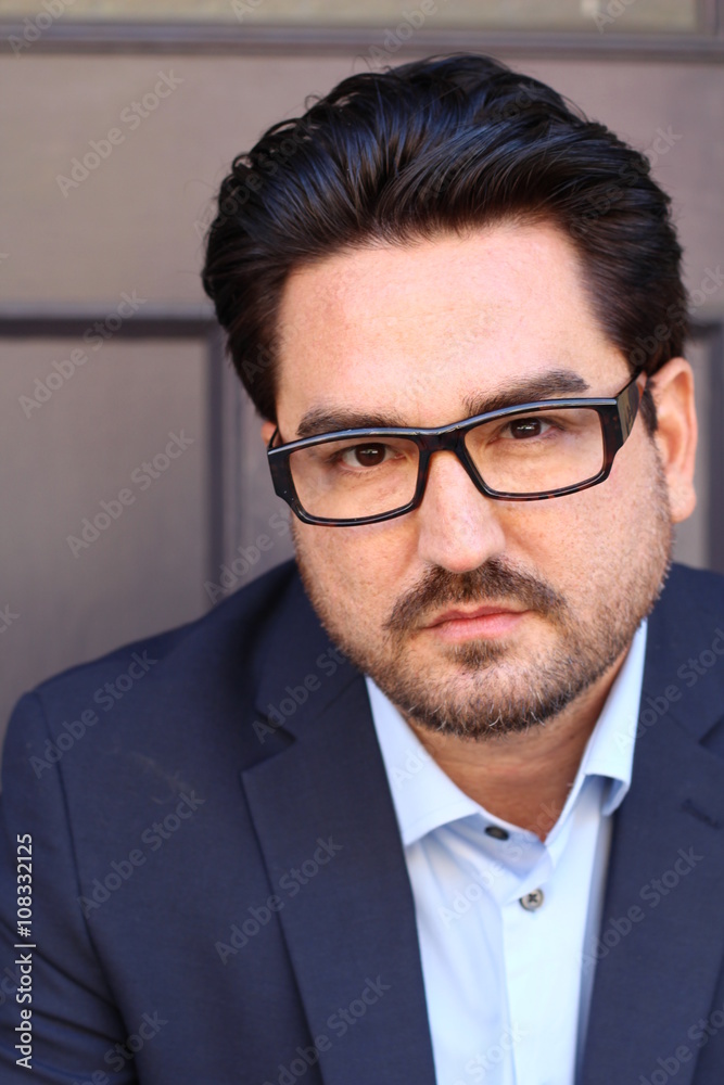 Closeup portrait of a businessman against purple background Closeup portrait of a businessman against purple background