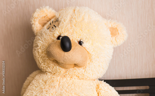 portrait of a cute beige teddy bear for kids with happy smiling facial expression. 
