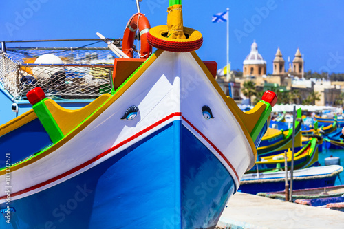 traditional colorful fishing boats luzzu in Malta,Marsaxlokk village photo