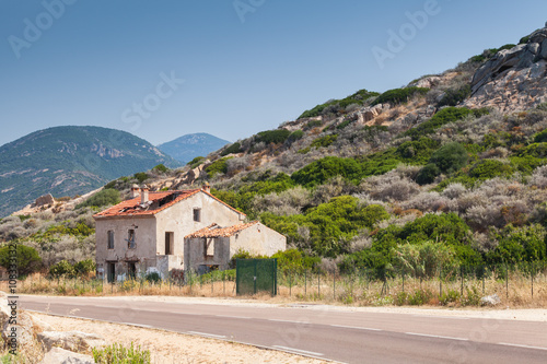 Abandoned house near a highway, Corsica © evannovostro