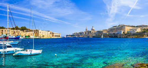 panoramic view of Valetta with sailing boats in turquoise sea. Malta photo
